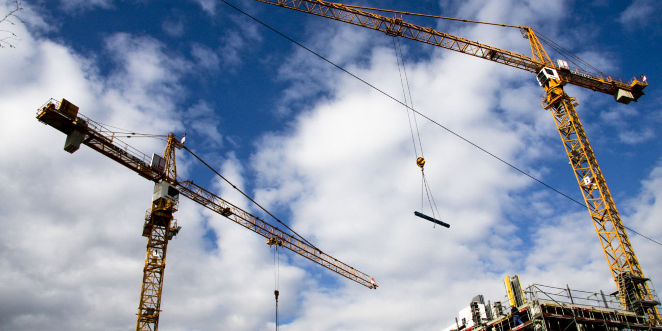 Cranes being used to build a building