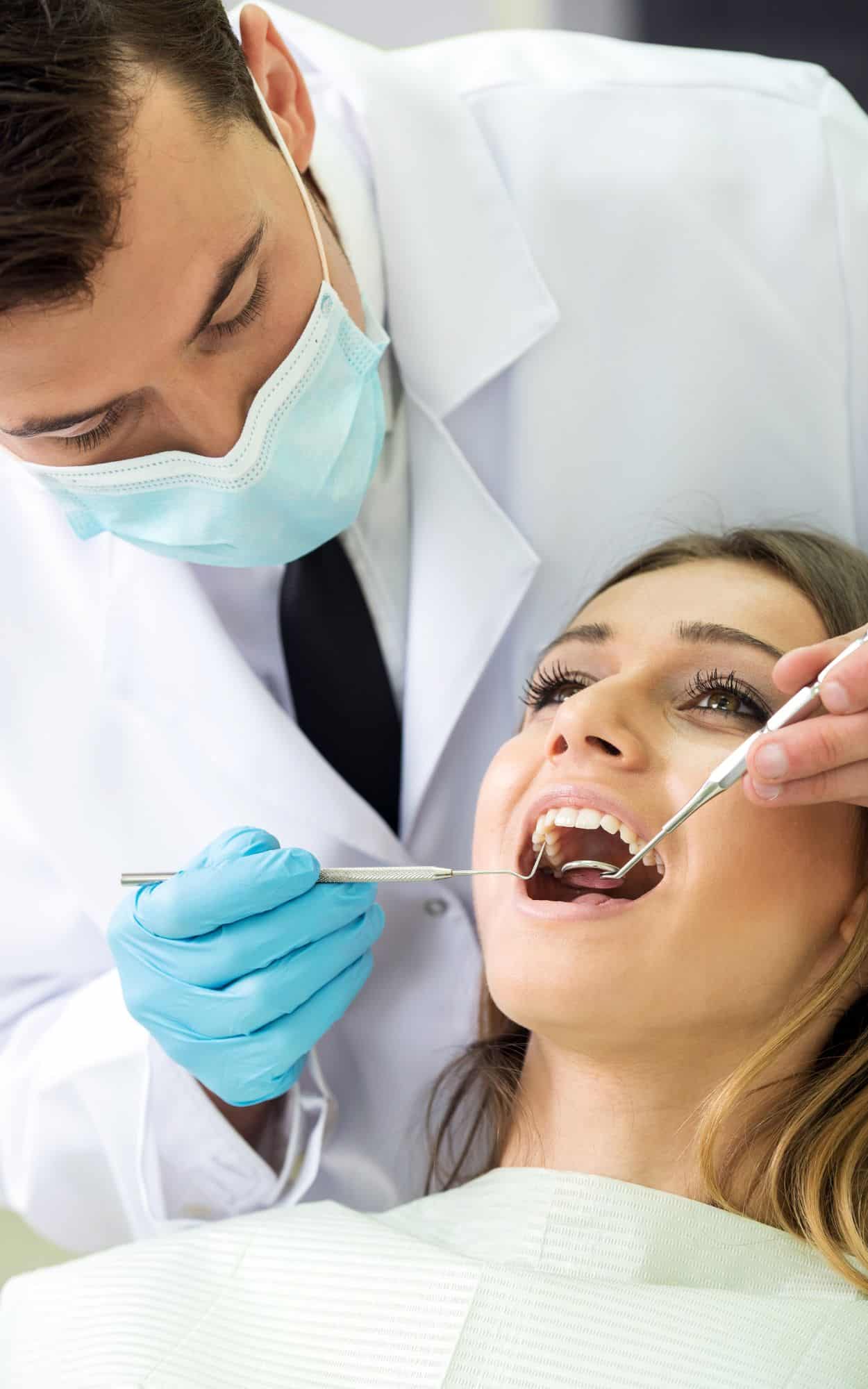 Dentist performing procedure on patient